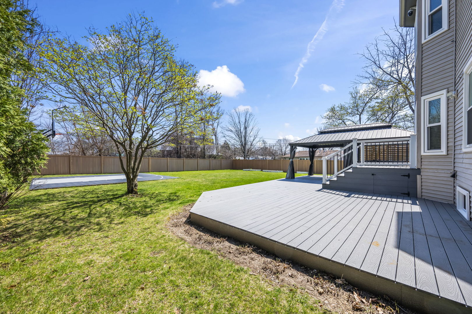 155 Lilac Lane Wheeling, IL 60090 - Photo 46 of 52 a view of a house with backyard and sitting area