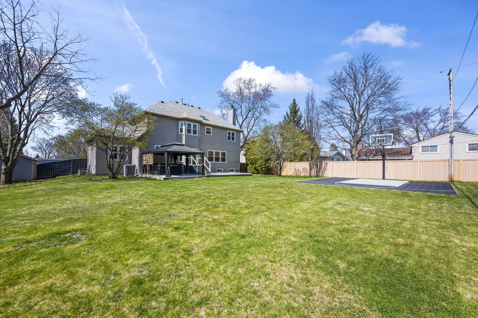 155 Lilac Lane Wheeling, IL 60090 - Photo 50 of 52 a view of a house with a big yard