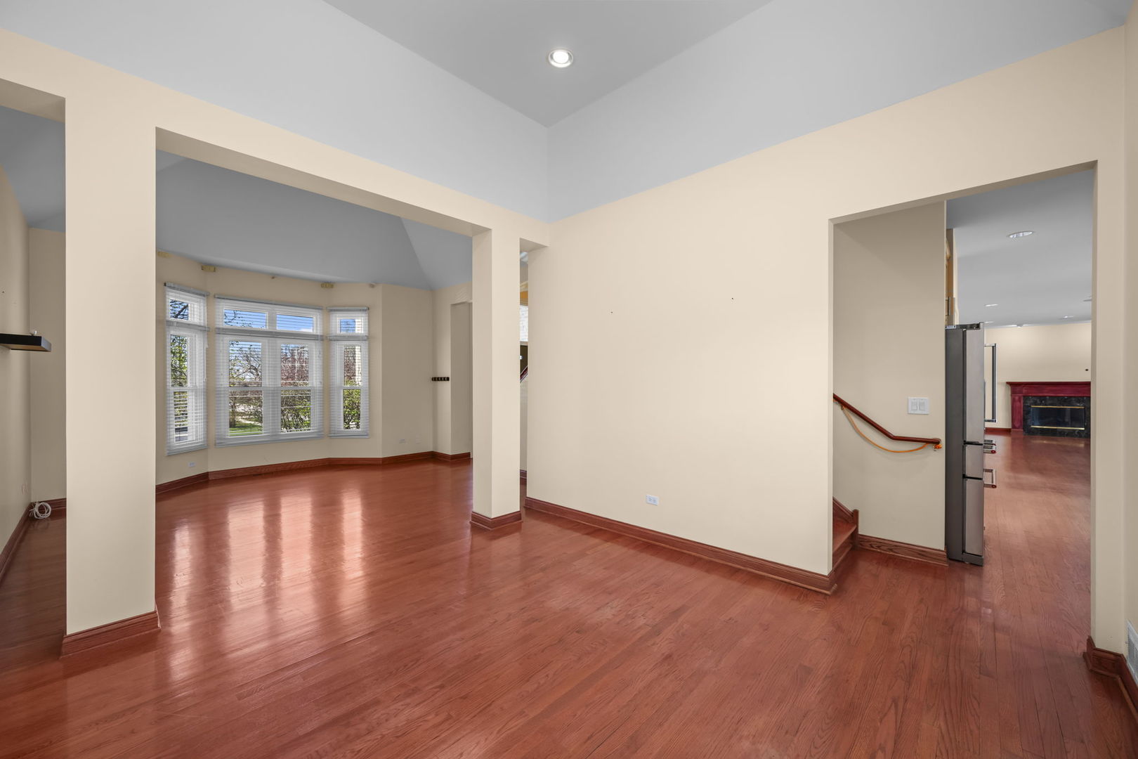 155 Lilac Lane Wheeling, IL 60090 - Photo 10 of 52 wooden floor in an empty room with a window
