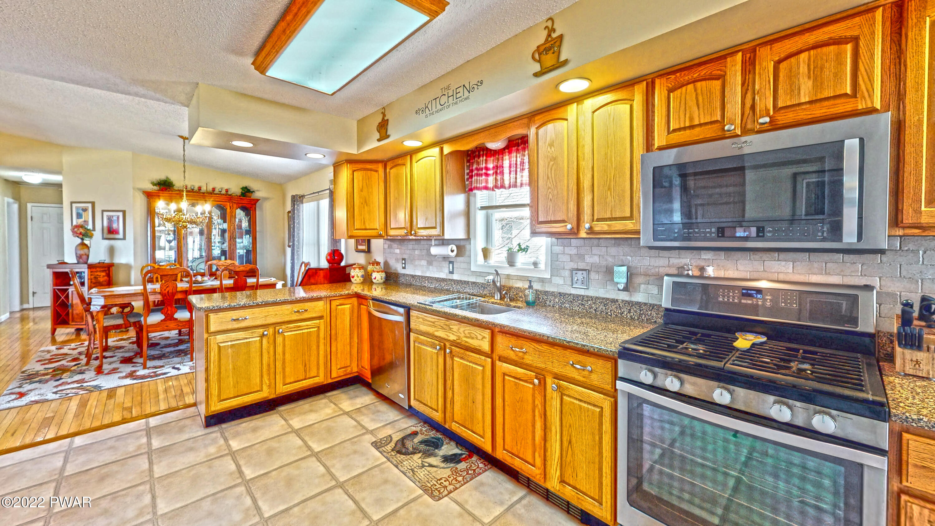 80 Boulder Road Lake Ariel, PA 18436 - Photo 16 of 59 a kitchen with stainless steel appliances granite countertop a stove a sink and a microwave