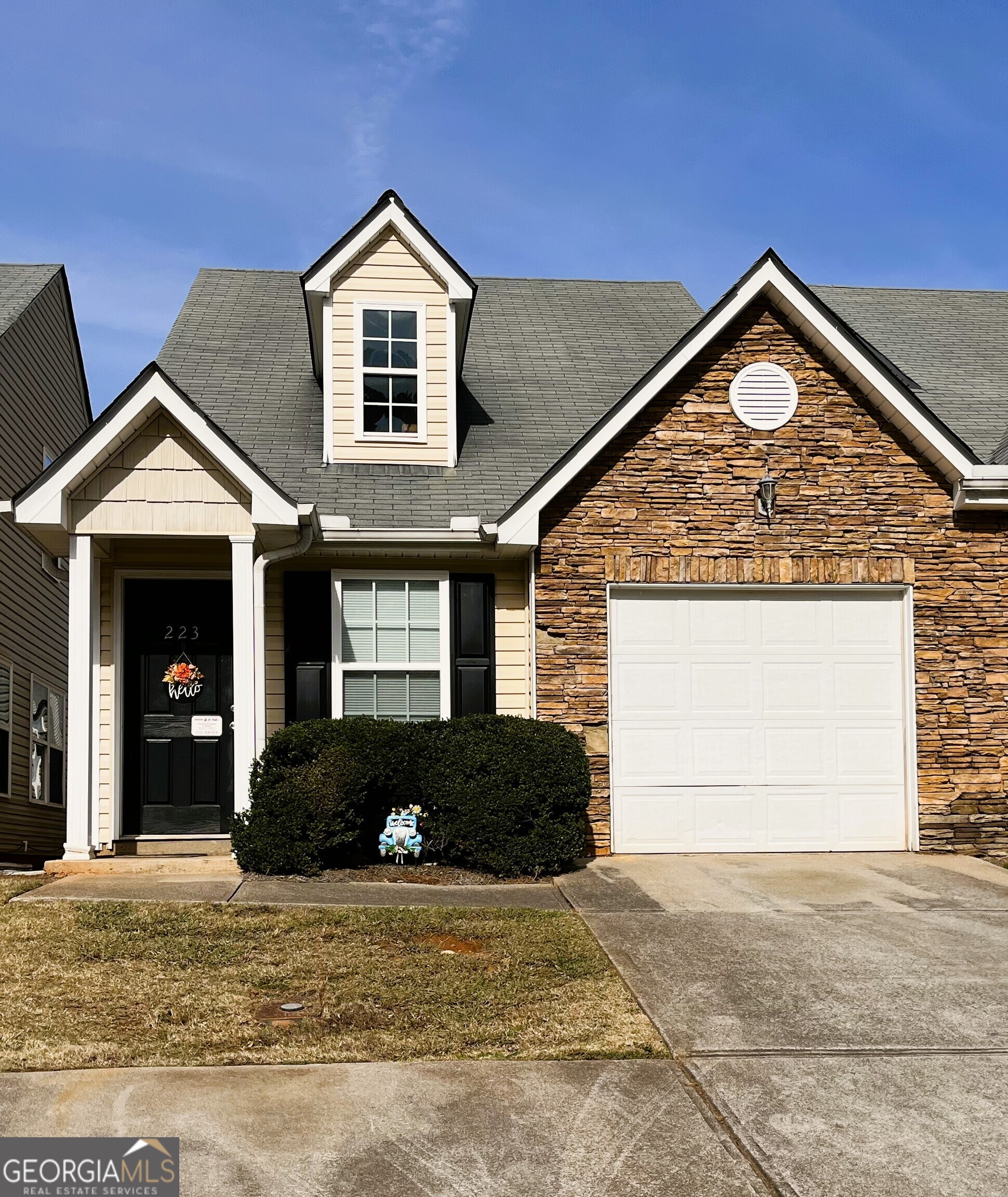 223 Alton Circle Villa Rica, GA 30180 - Photo 1 of 1 a front view of a house with a yard and garage