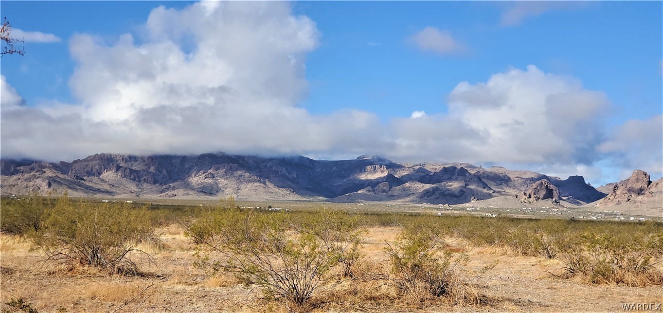 2660 Spinel Road Golden Valley, AZ 86413 - Photo 6 of 9 a view of a lake with a mountain in the background