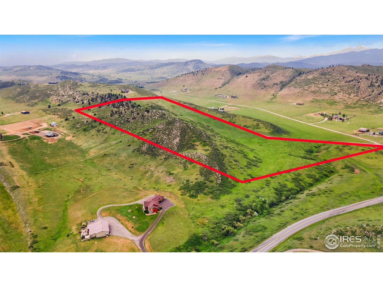 5644 Kiva Ridge Drive Berthoud, CO 80513 - Photo 1 of 11 a bird view of a building and mountains