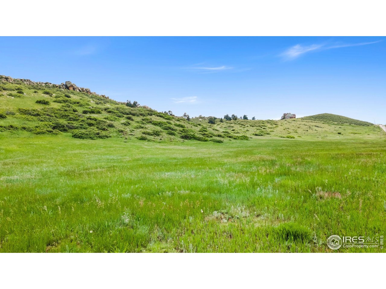 5644 Kiva Ridge Drive Berthoud, CO 80513 - Photo 4 of 11 a open area with grassy field
