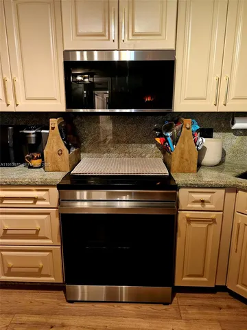 a white cabinet with a black white door