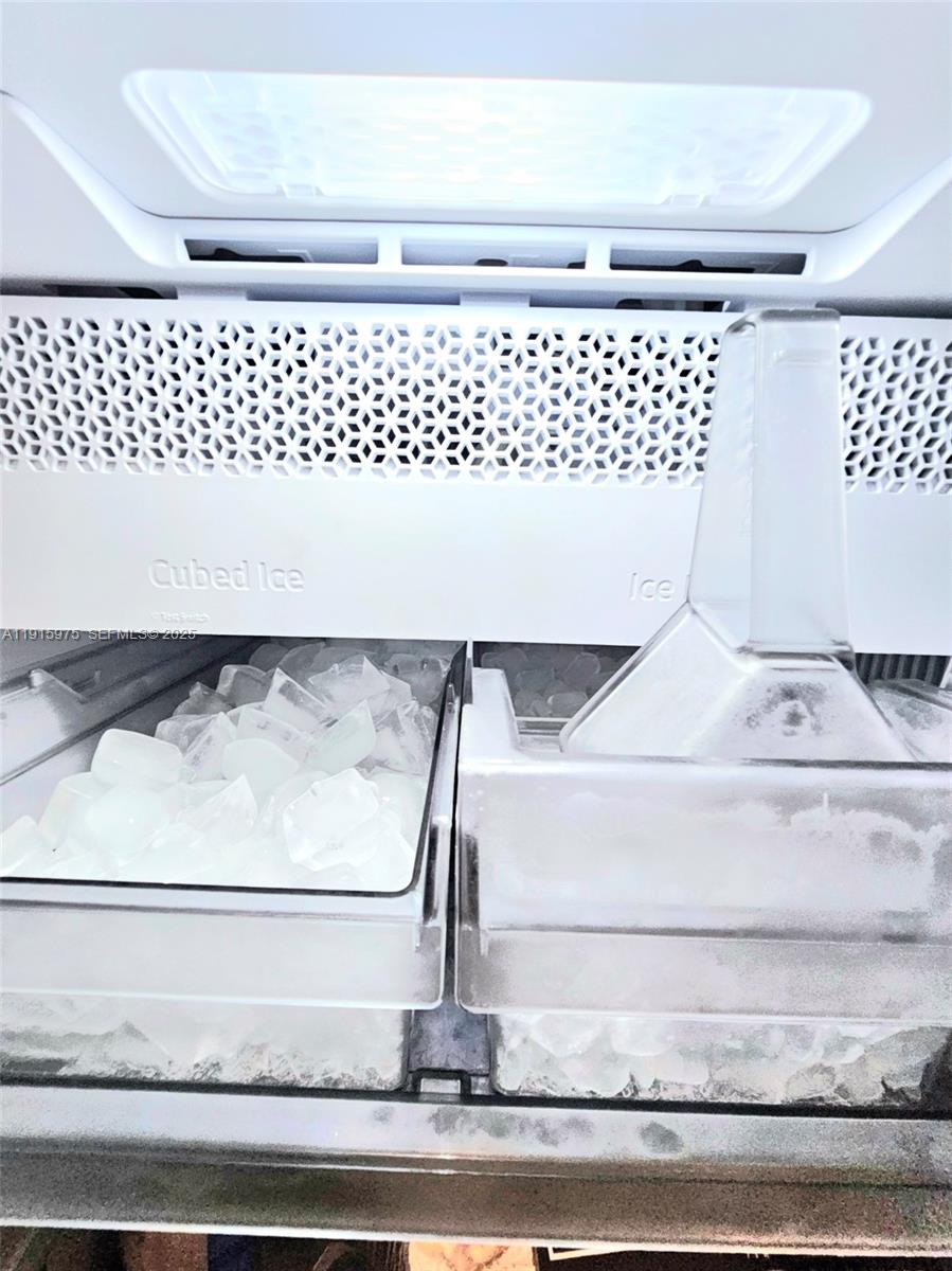 1800 North Andrews Avenue, Unit 2H Fort Lauderdale, FL 33311 - Photo 16 of 60 a white cabinet with a black white door