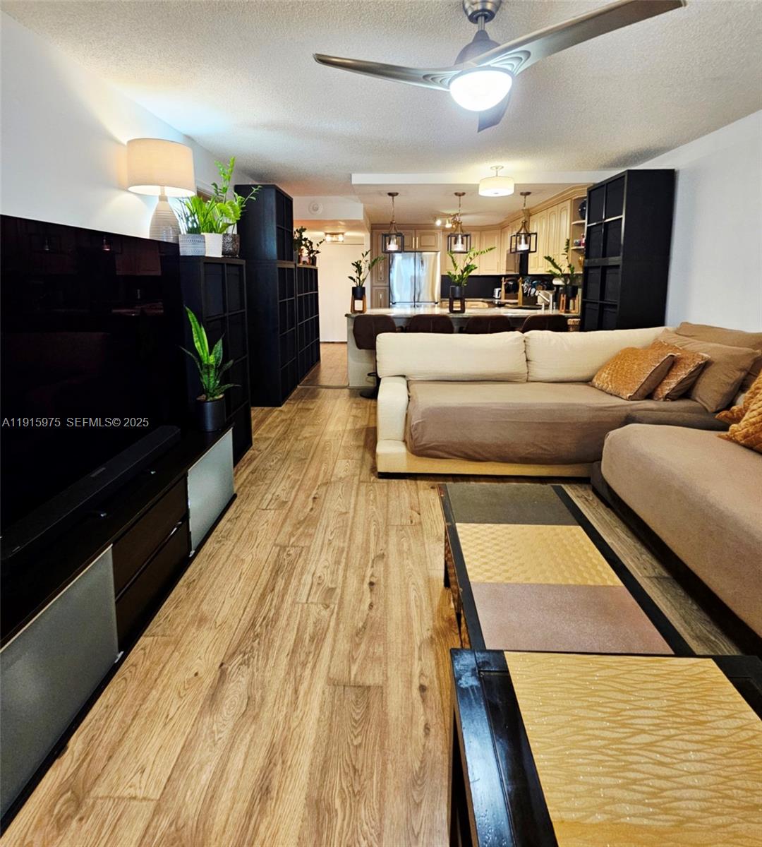 1800 North Andrews Avenue, Unit 2H Fort Lauderdale, FL 33311 - Photo 19 of 60 a living room with stainless steel appliances kitchen island granite countertop furniture and a rug