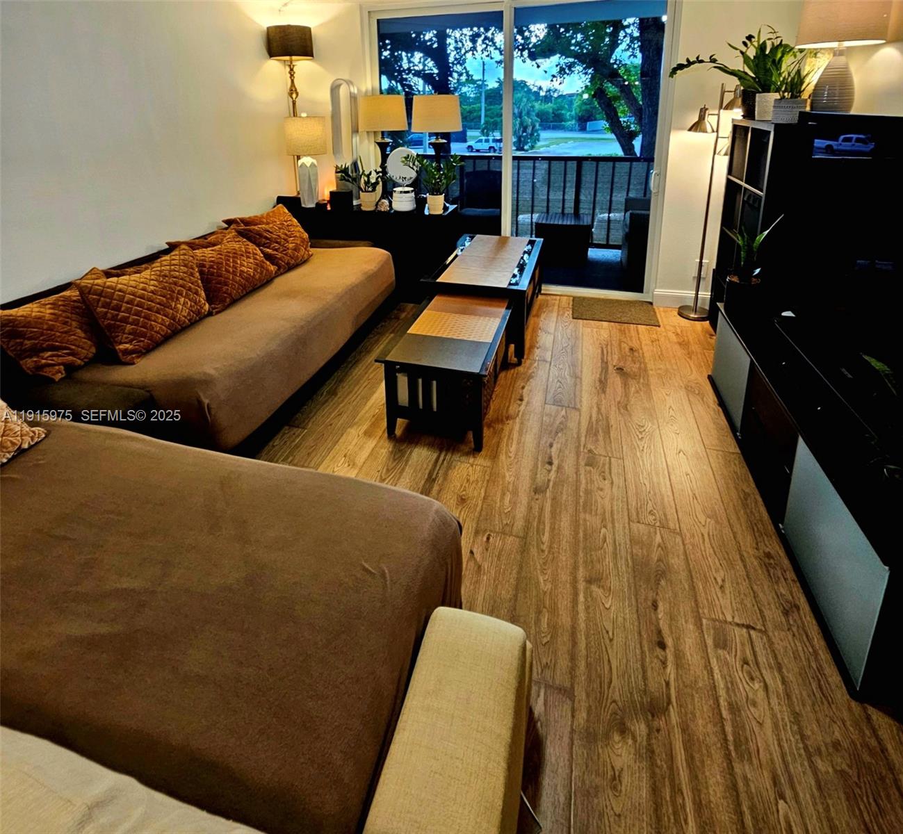 1800 North Andrews Avenue, Unit 2H Fort Lauderdale, FL 33311 - Photo 21 of 60 a living room with furniture and a wooden floor