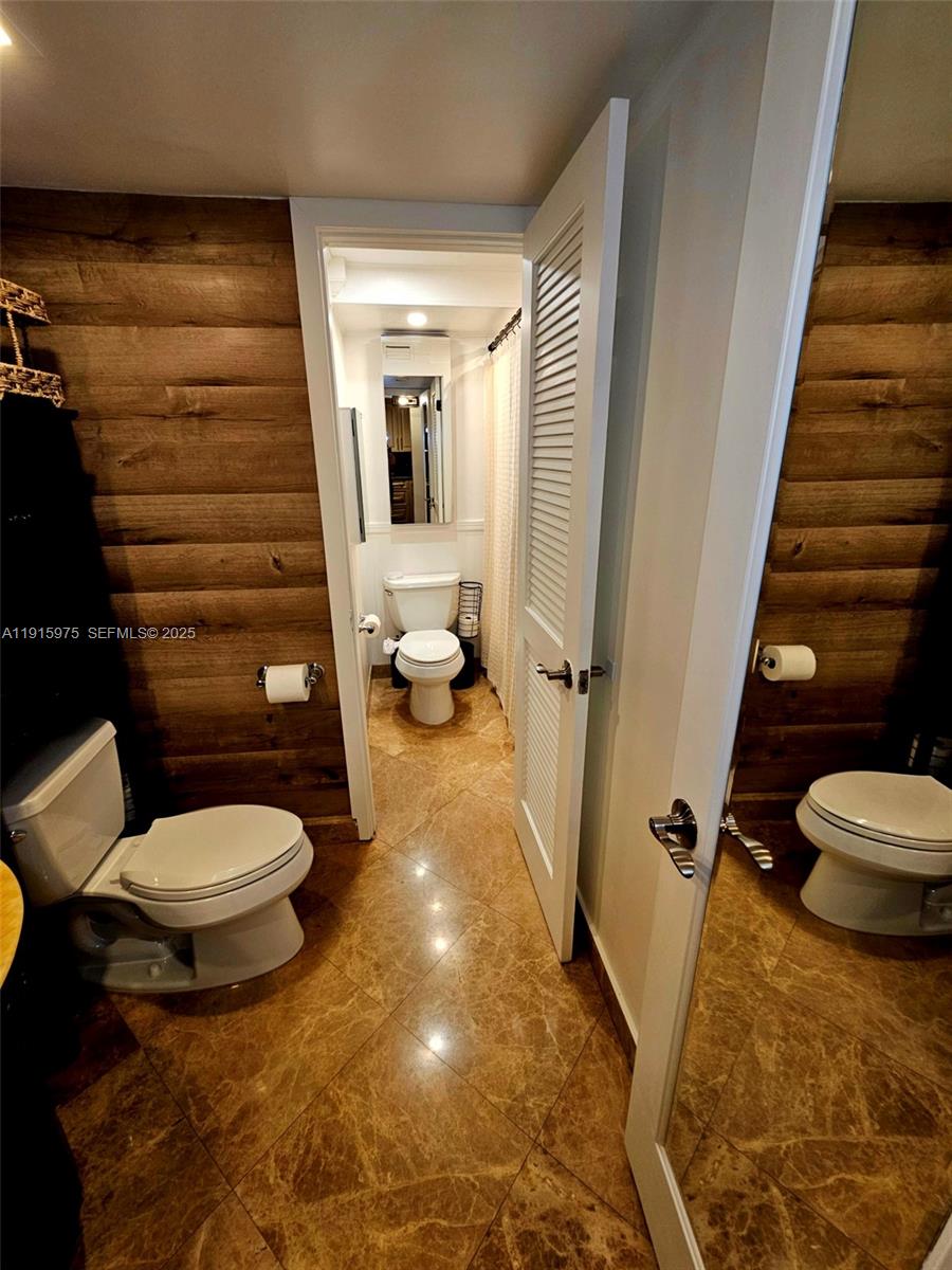 1800 North Andrews Avenue, Unit 2H Fort Lauderdale, FL 33311 - Photo 38 of 60 a bathroom with a toilet and a shower