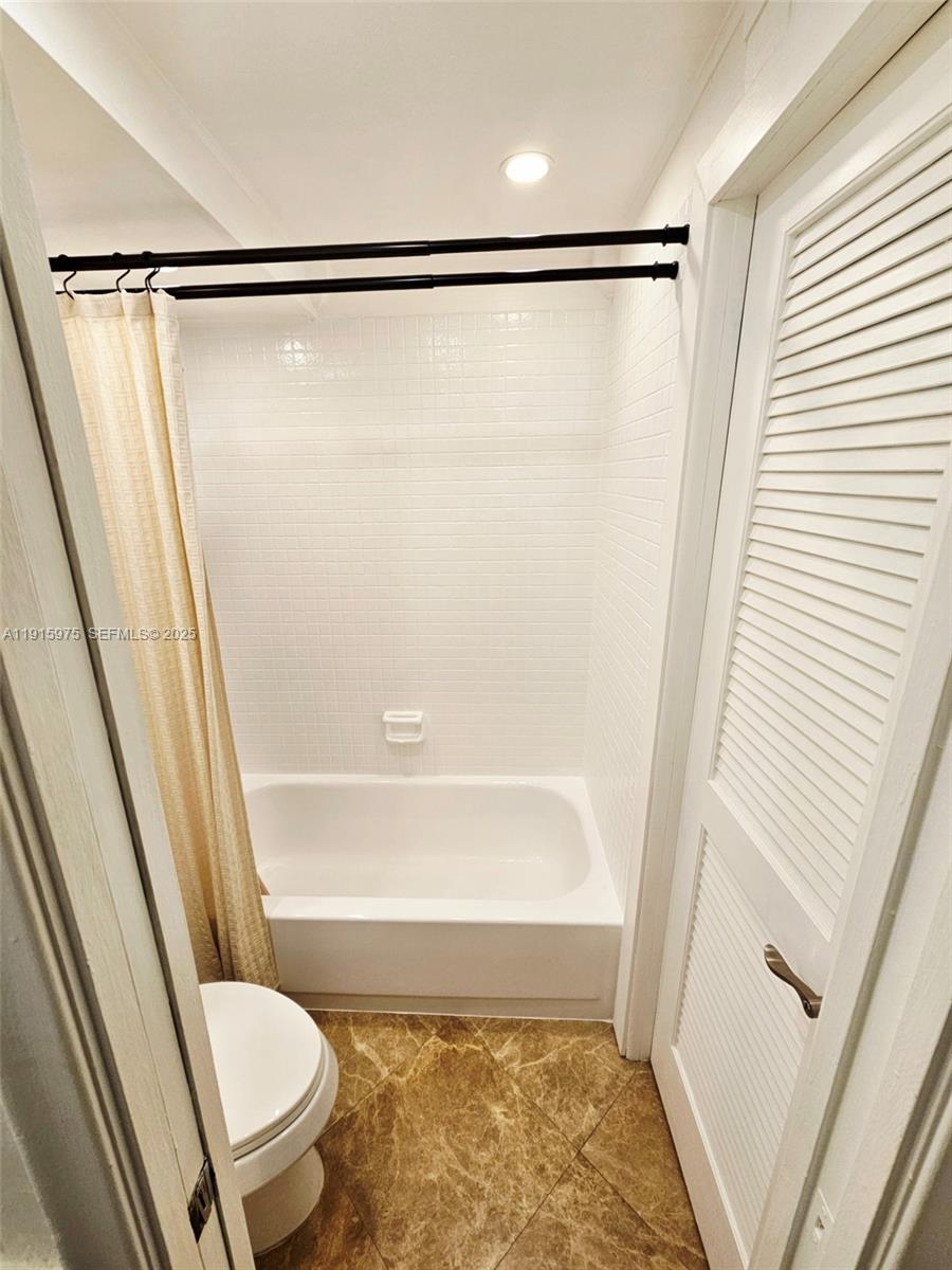 1800 North Andrews Avenue, Unit 2H Fort Lauderdale, FL 33311 - Photo 42 of 60 a bathroom with a shower and a toilet