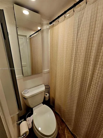 a view of a patio with wooden fence