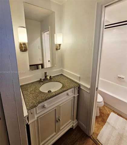 a wooden bench sitting in the middle of a lake