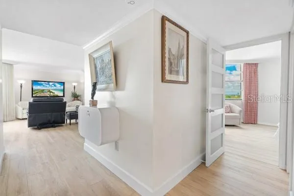 a bedroom with a bed and lamp on desk