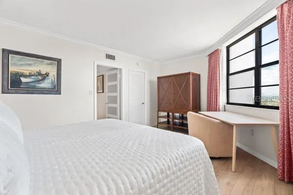 a bathroom with a sink a toilet a mirror a bathtub and shower