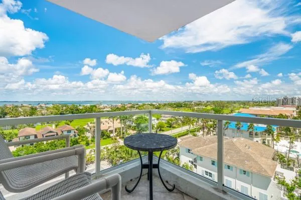 a view of a dining room with furniture large window and wooden floor