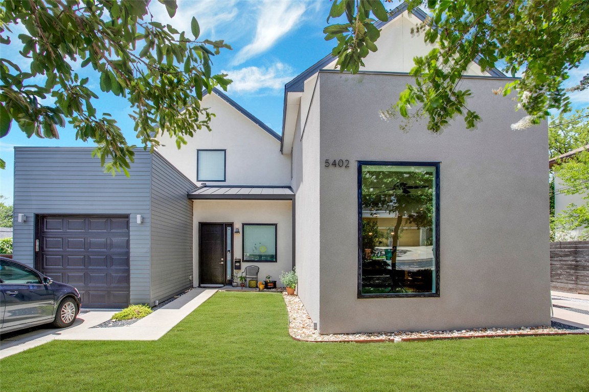 5402 Woodrow Avenue, Unit B Austin, TX 78756 - Photo 2 of 36 a view of a backyard with a large tree