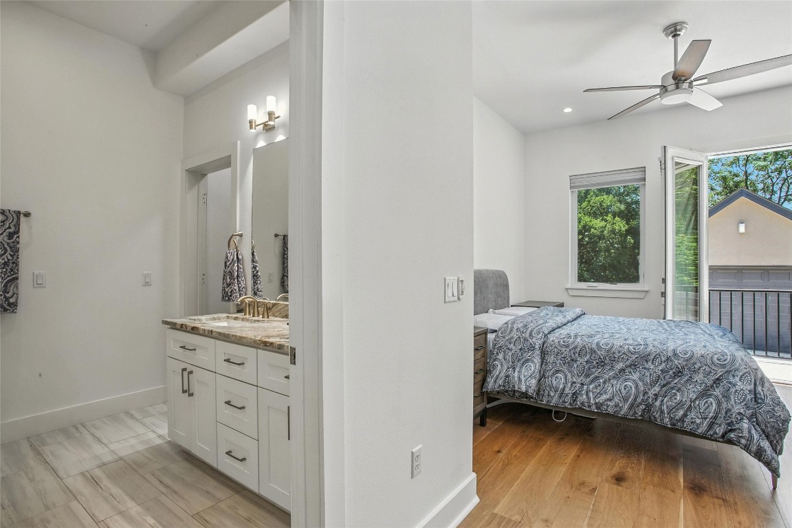 5402 Woodrow Avenue, Unit B Austin, TX 78756 - Photo 20 of 36 a bedroom with a bed and a dresser