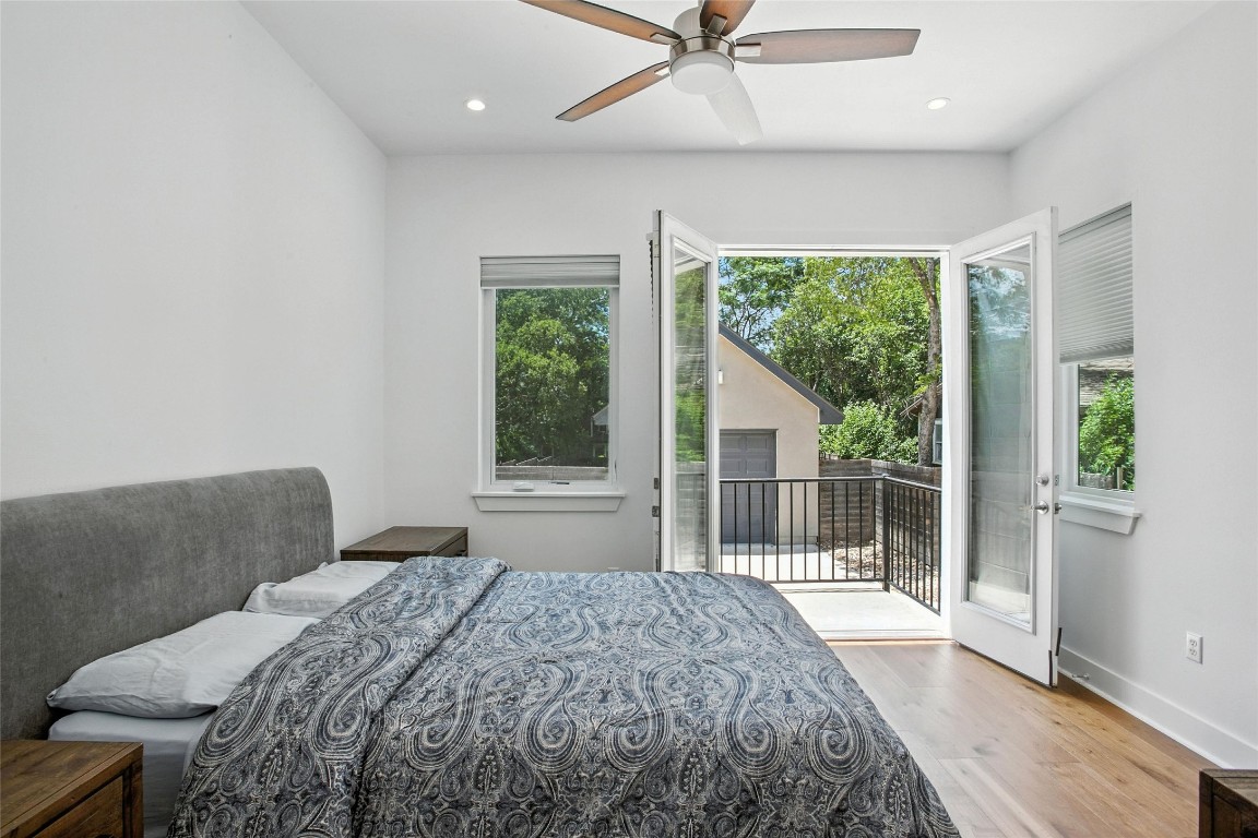 5402 Woodrow Avenue, Unit B Austin, TX 78756 - Photo 21 of 36 a bedroom with a bed and a large window