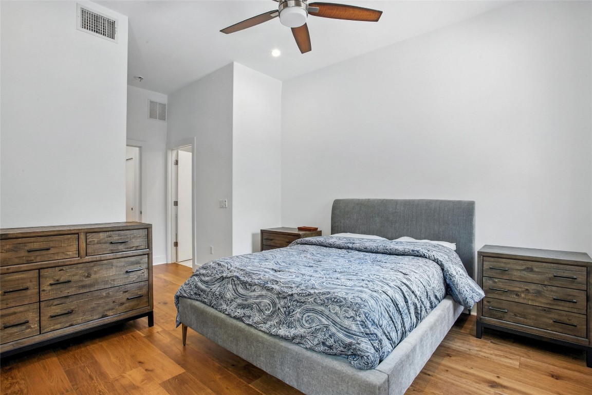 5402 Woodrow Avenue, Unit B Austin, TX 78756 - Photo 23 of 36 a bedroom with a bed and cabinet