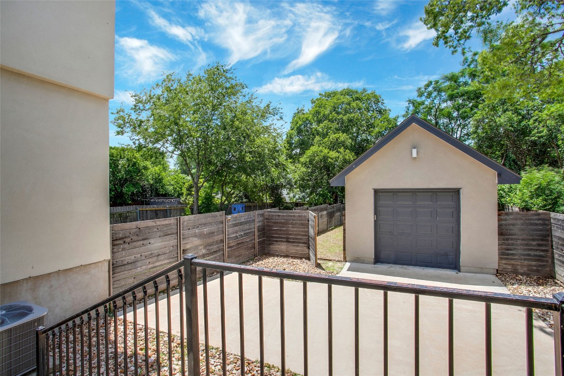 5402 Woodrow Avenue, Unit B Austin, TX 78756 - Photo 31 of 36 a view of a brick house and trees in the background