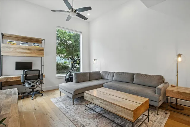 a living room with furniture a window and a fireplace