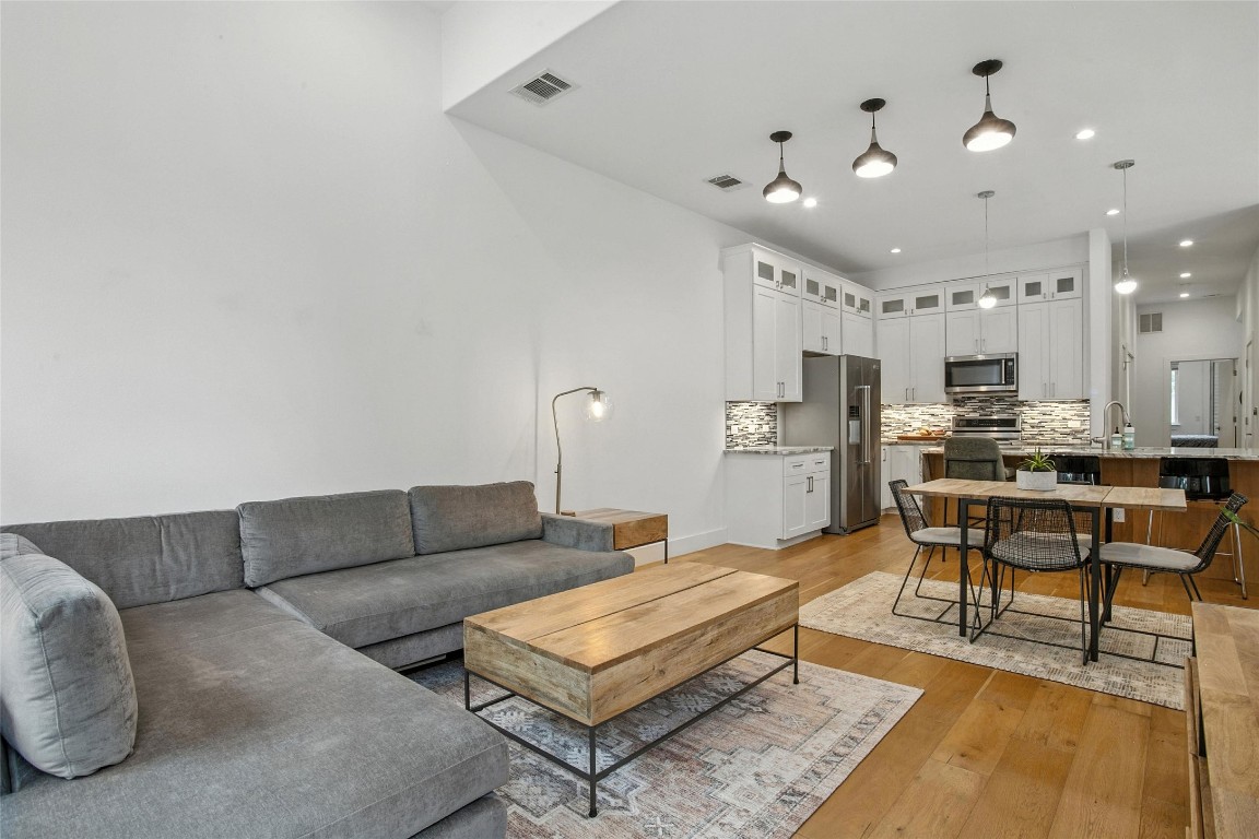 5402 Woodrow Avenue, Unit B Austin, TX 78756 - Photo 10 of 36 a living room with furniture and kitchen view