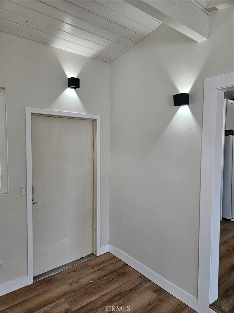 13100 Skiomah Road Apple Valley, CA 92308 - Photo 18 of 19 a view of an empty room with wooden floor