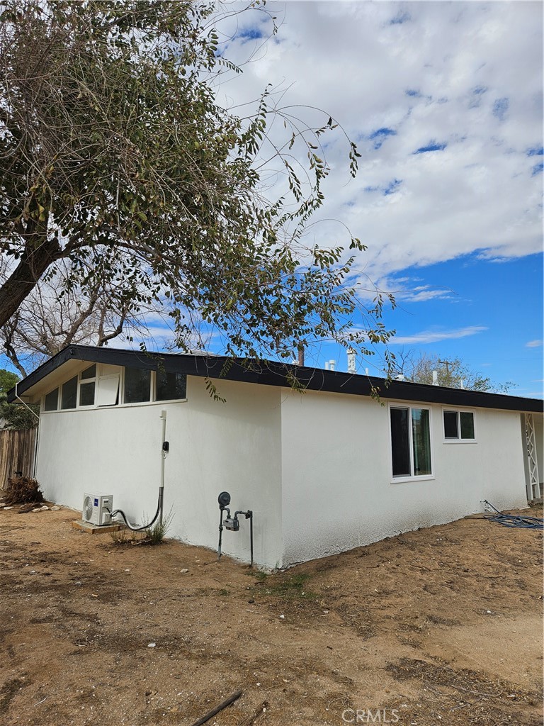 13100 Skiomah Road Apple Valley, CA 92308 - Photo 2 of 19 a house with trees in the background