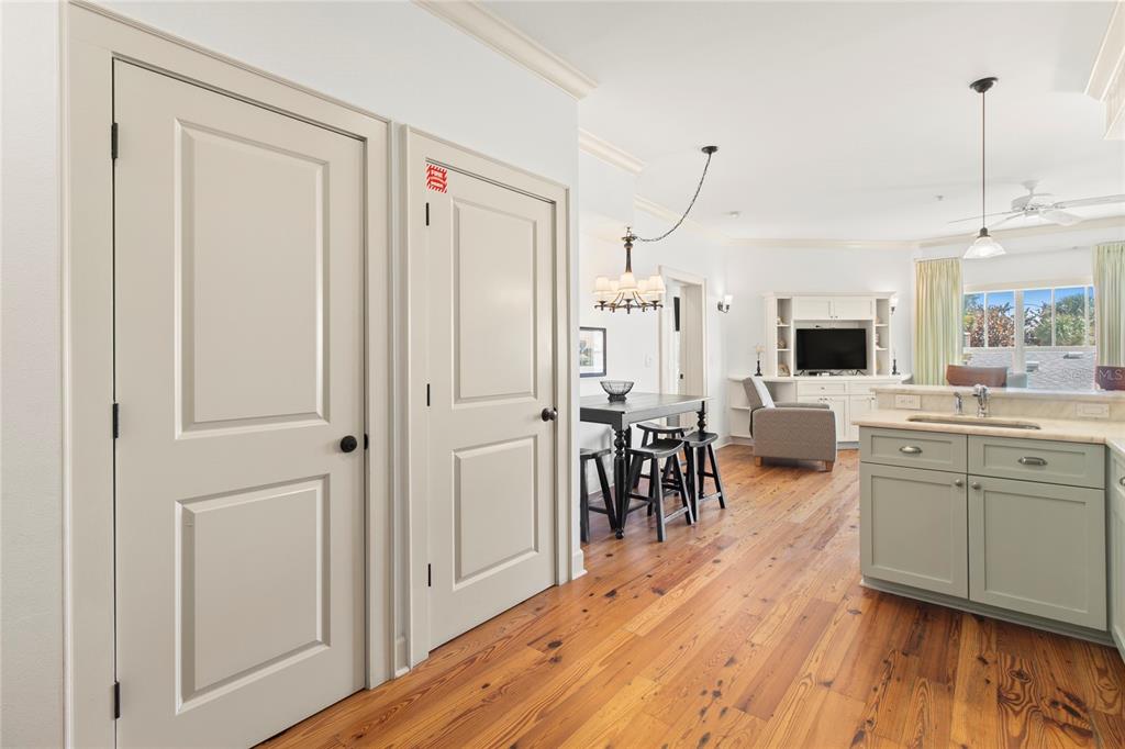 101 66th Street, Unit 6 Holmes Beach, FL 34217 - Photo 22 of 48 a view of a living room kitchen and a wooden floor