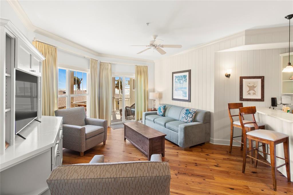 101 66th Street, Unit 6 Holmes Beach, FL 34217 - Photo 26 of 48 a living room with furniture and a wooden floor