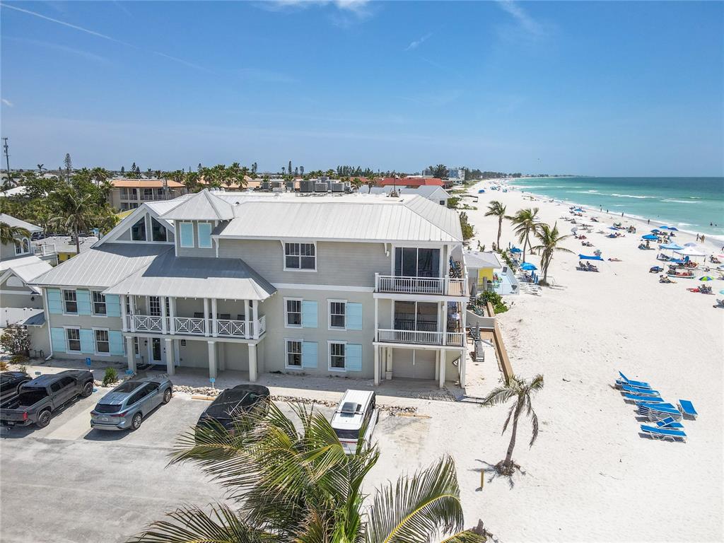 101 66th Street, Unit 6 Holmes Beach, FL 34217 - Photo 3 of 48 a view of a patio with a table and chairs