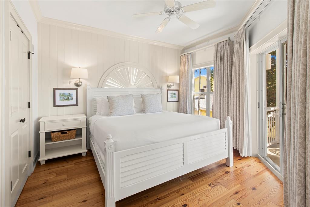 101 66th Street, Unit 6 Holmes Beach, FL 34217 - Photo 31 of 48 a bedroom with a bed and a window