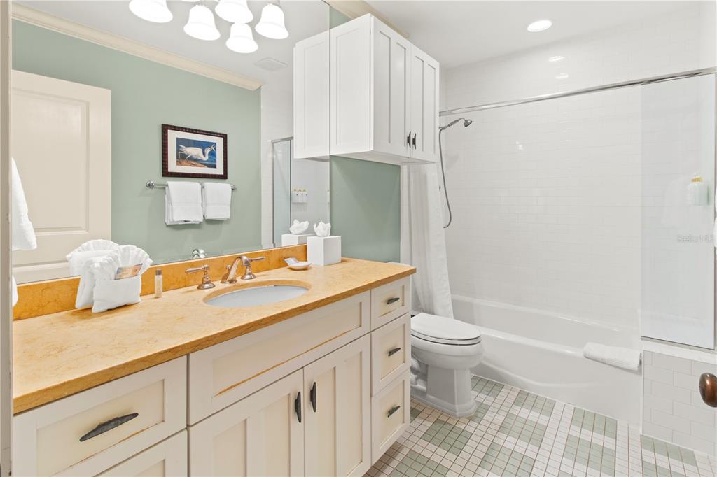 101 66th Street, Unit 6 Holmes Beach, FL 34217 - Photo 41 of 48 a bathroom with a sink toilet and shower
