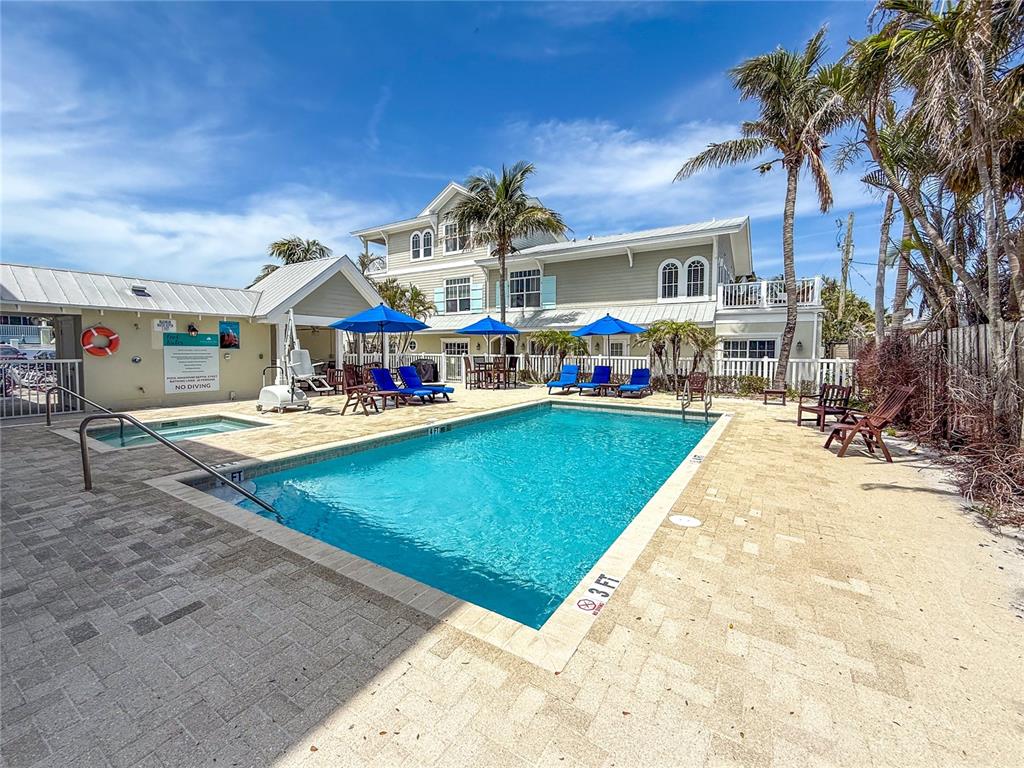 101 66th Street, Unit 6 Holmes Beach, FL 34217 - Photo 44 of 48 a view of a swimming pool with a patio