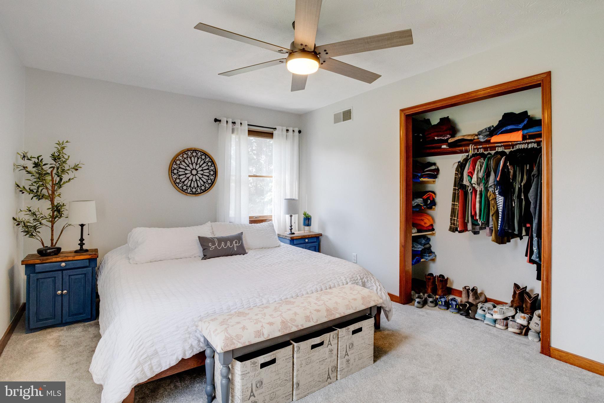 140 Red Pump Road Rising Sun, MD 21911 - Photo 31 of 114 a bedroom with a bed and a chandelier