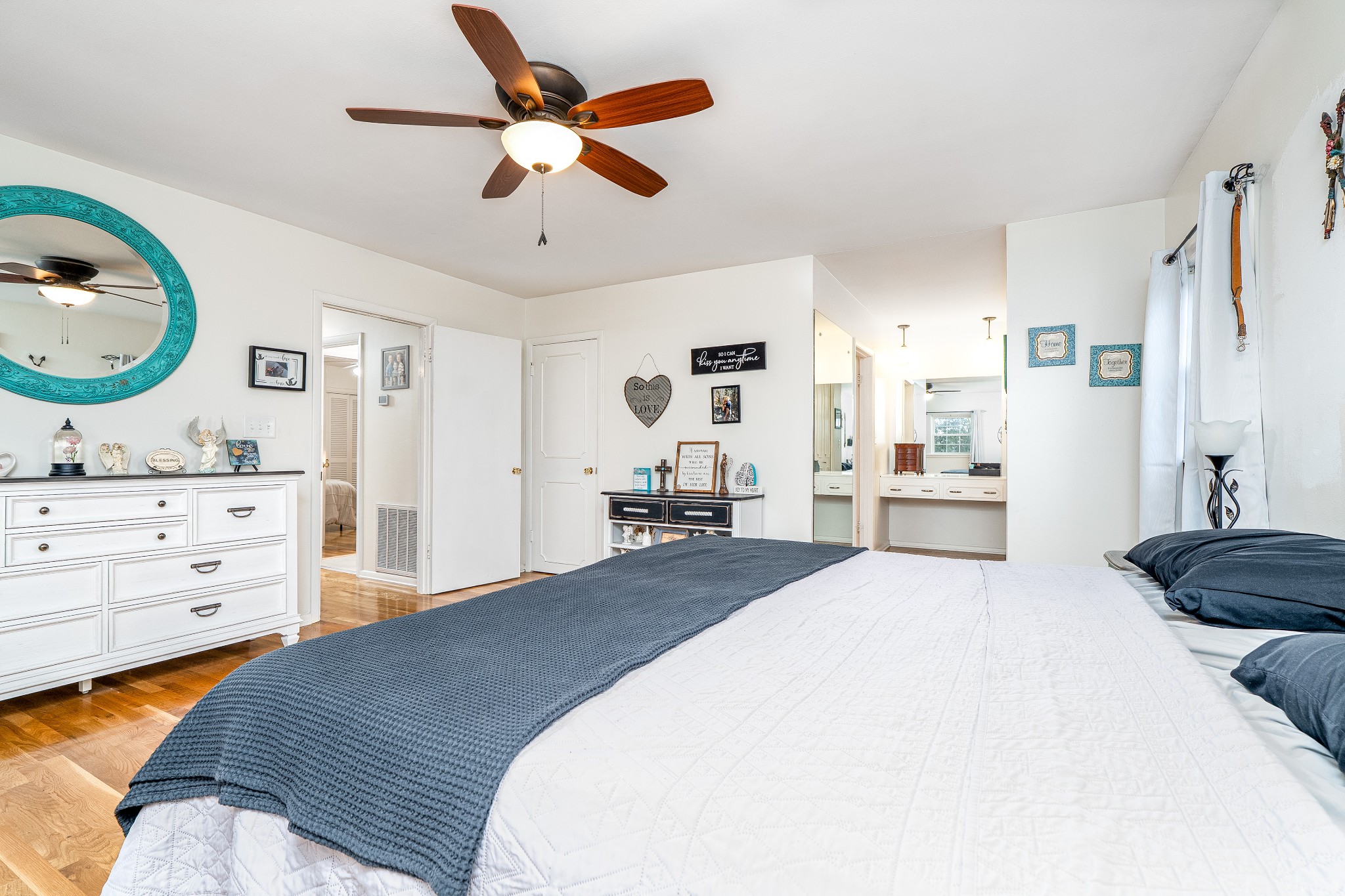 545 Puryears Bend Road Hartsville, TN 37074 - Photo 12 of 46 a bedroom with a bed and dresser with mirror