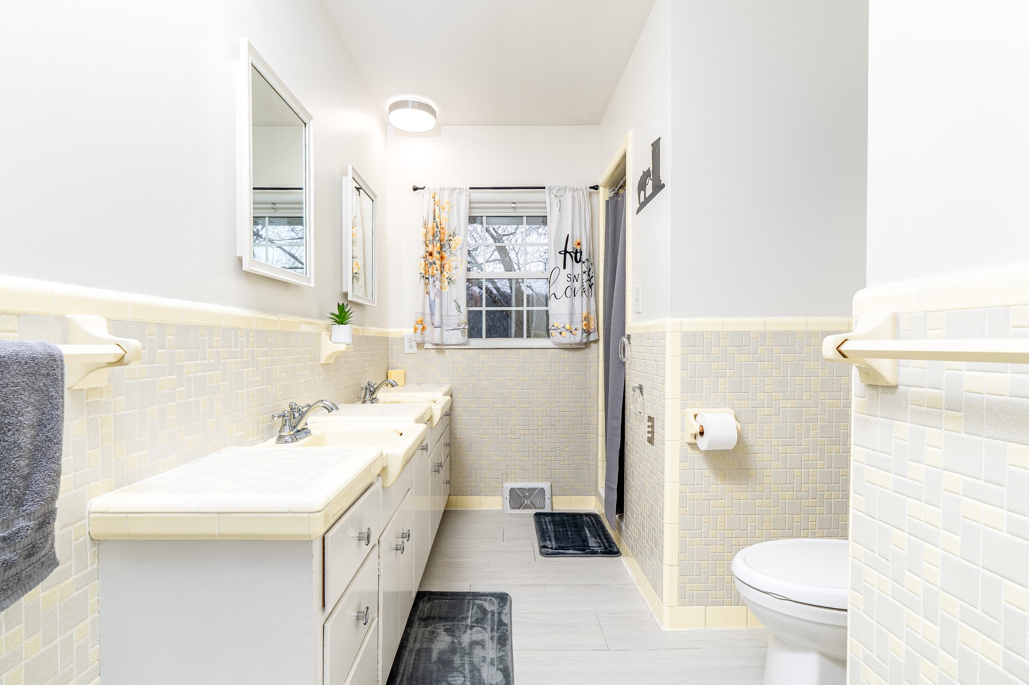 545 Puryears Bend Road Hartsville, TN 37074 - Photo 19 of 46 a bathroom with a double vanity sink toilet and shower