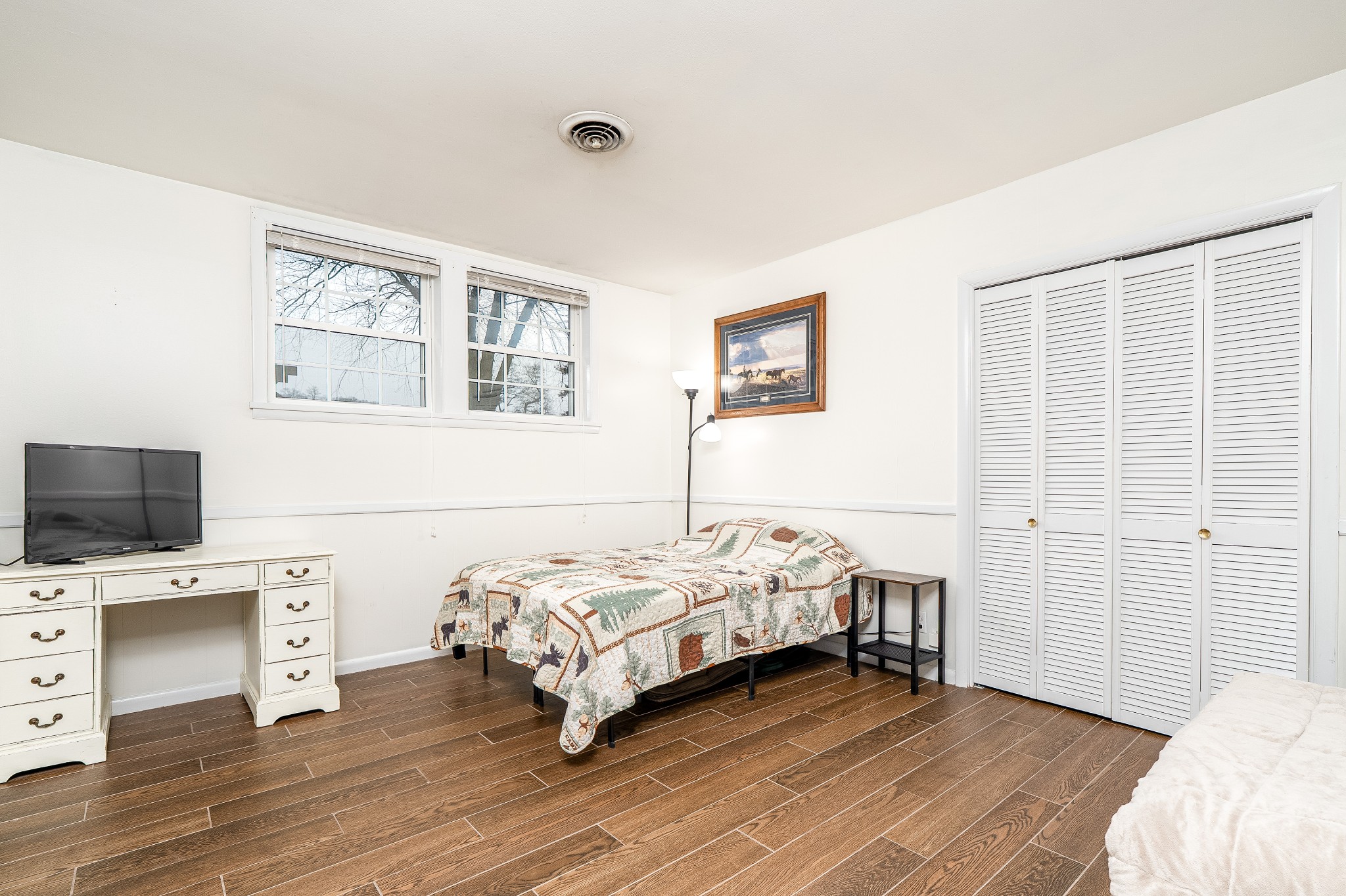 545 Puryears Bend Road Hartsville, TN 37074 - Photo 22 of 46 a bedroom with a bed and a flat screen tv