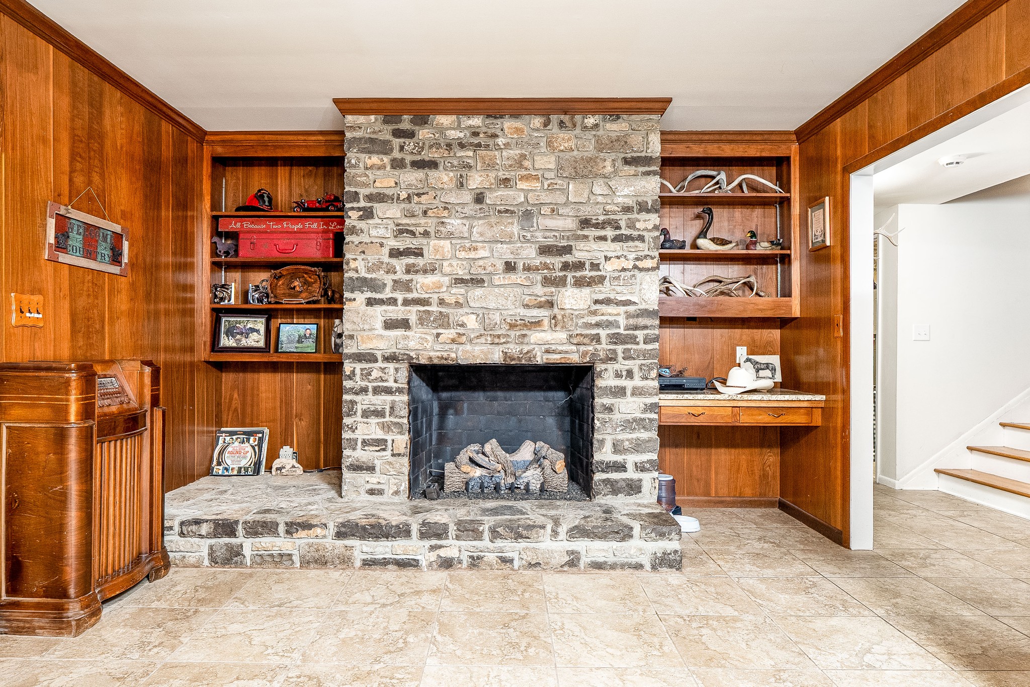 545 Puryears Bend Road Hartsville, TN 37074 - Photo 28 of 46 a living room with a couch and a fireplace