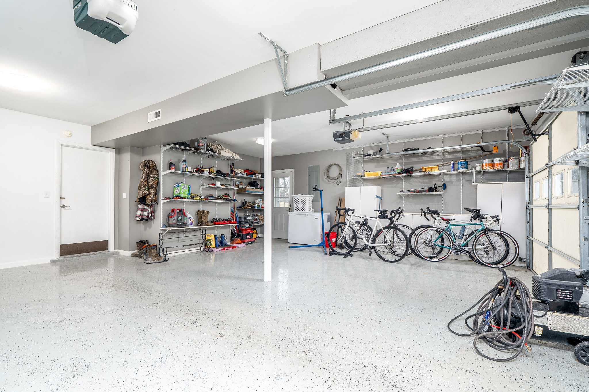 545 Puryears Bend Road Hartsville, TN 37074 - Photo 33 of 46 a view of a garage with a bike and car
