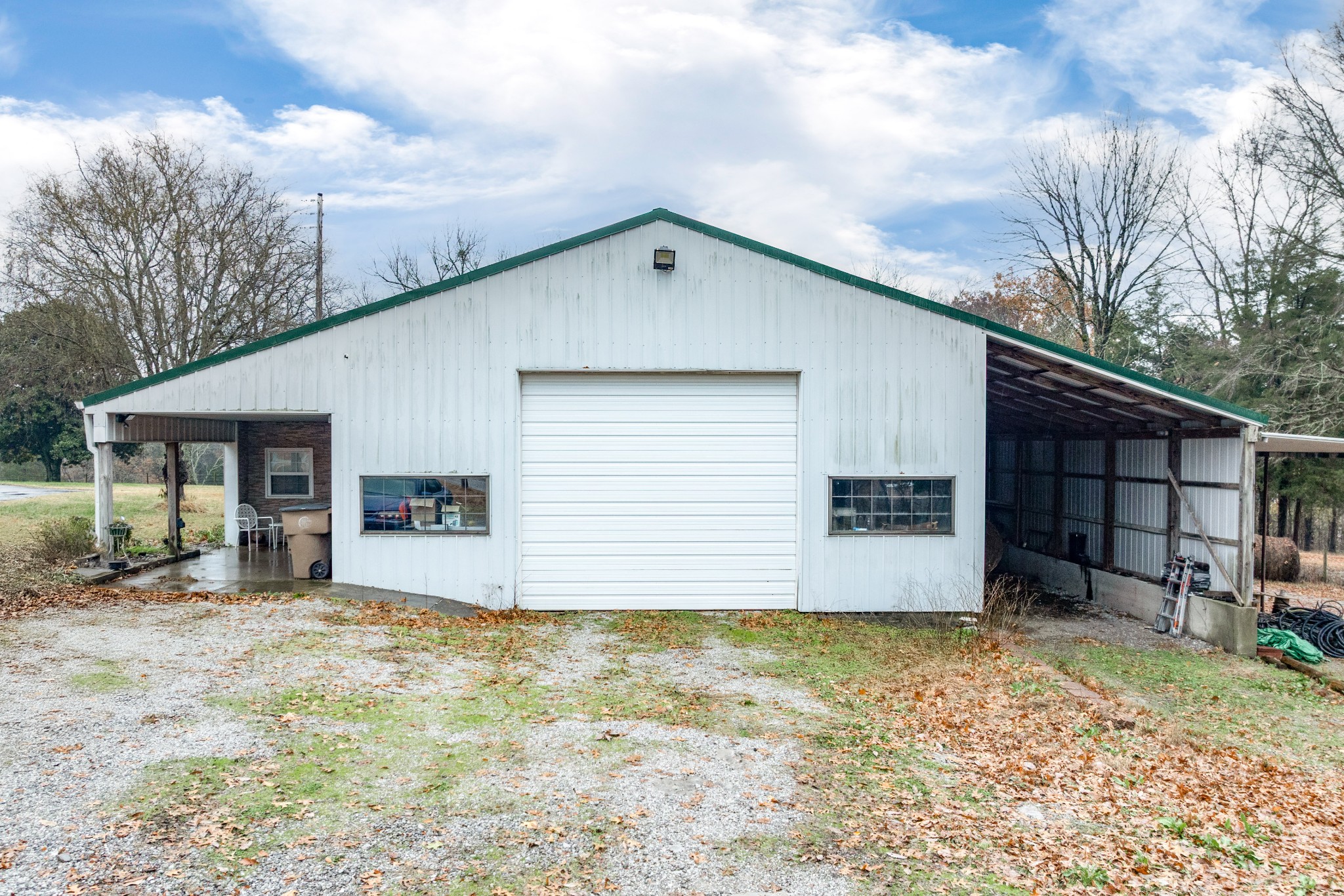 545 Puryears Bend Road Hartsville, TN 37074 - Photo 39 of 46 a view of a house with a yard and garage