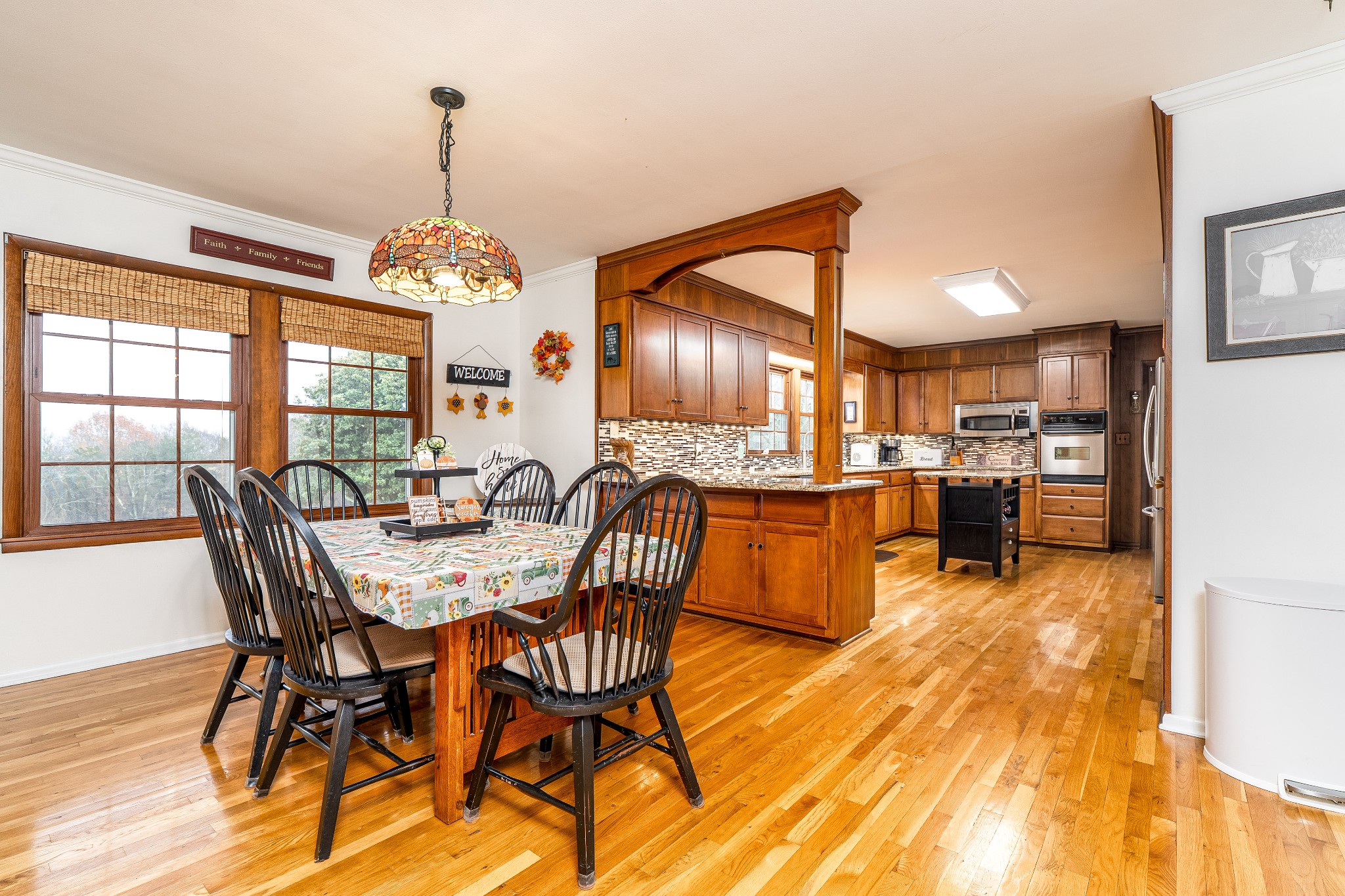 545 Puryears Bend Road Hartsville, TN 37074 - Photo 5 of 46 a view of a dining room with furniture window and wooden floor