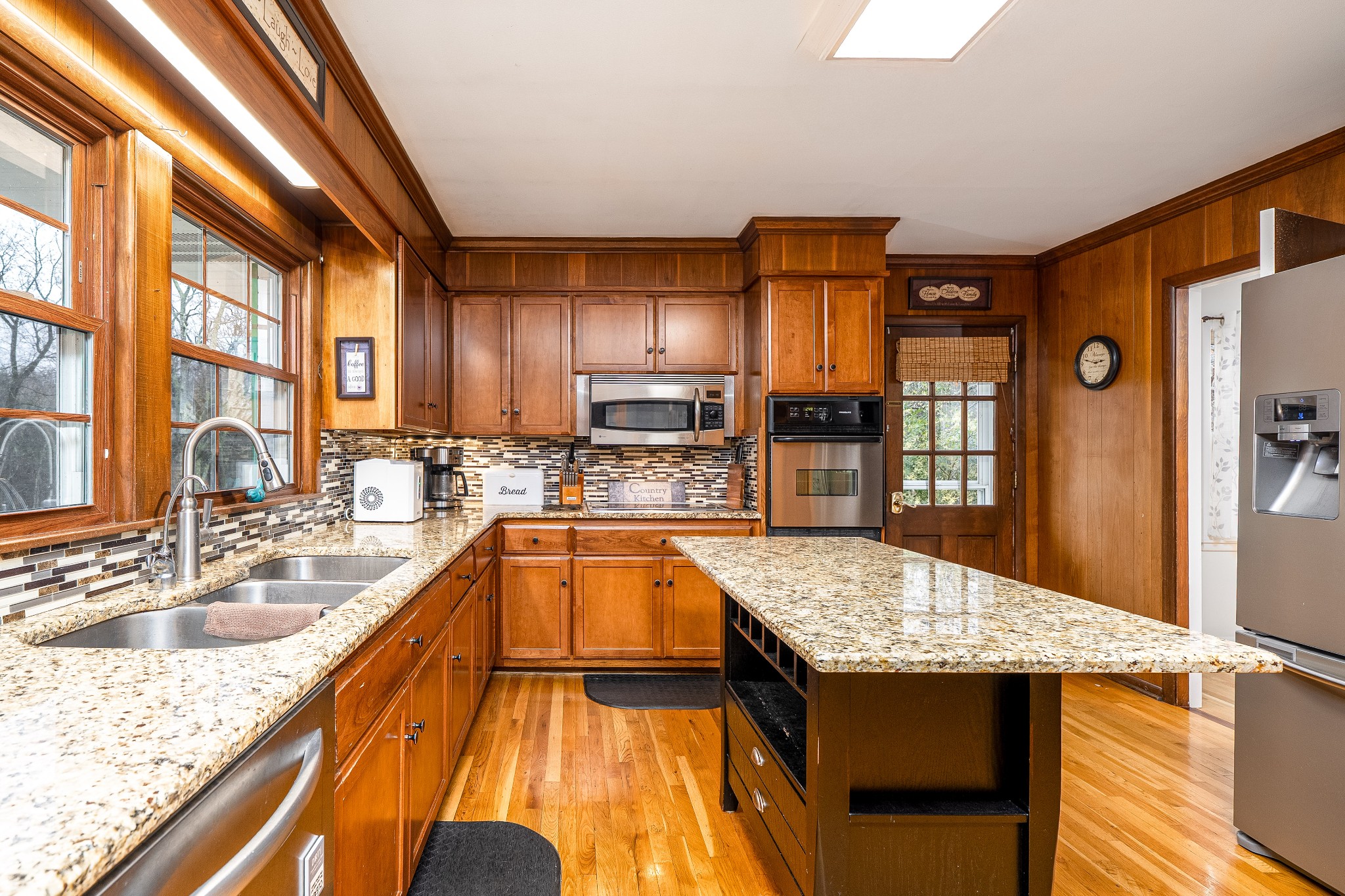545 Puryears Bend Road Hartsville, TN 37074 - Photo 8 of 46 a kitchen with stainless steel appliances granite countertop a sink stove and refrigerator