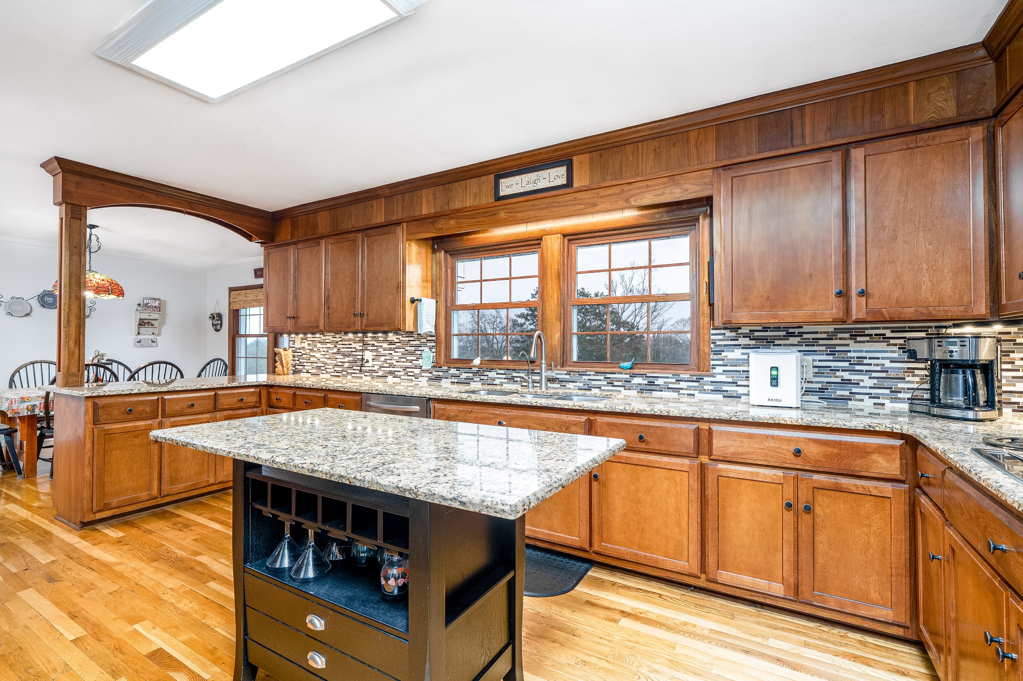 545 Puryears Bend Road Hartsville, TN 37074 - Photo 9 of 46 a kitchen with stainless steel appliances granite countertop a stove a sink and a wooden cabinets
