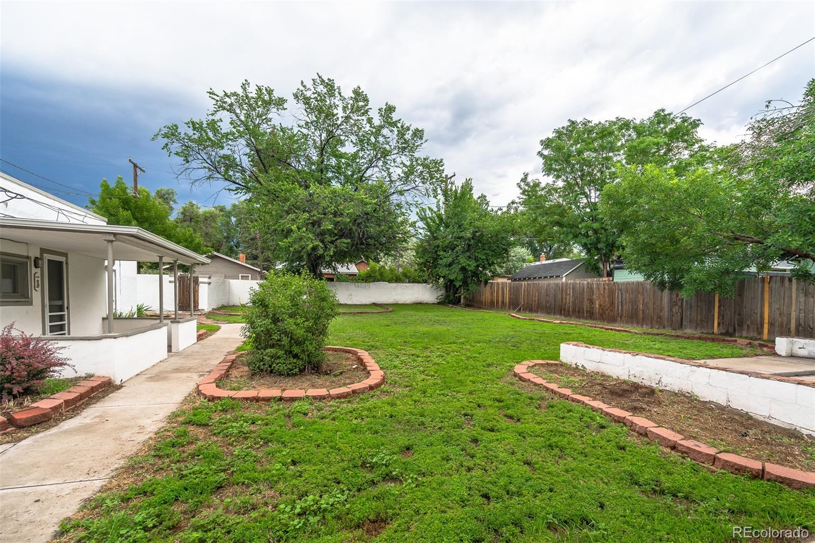1118 East Platte Avenue, Unit B Colorado Springs, CO 80903 - Photo 14 of 15 a view of a backyard with a slide