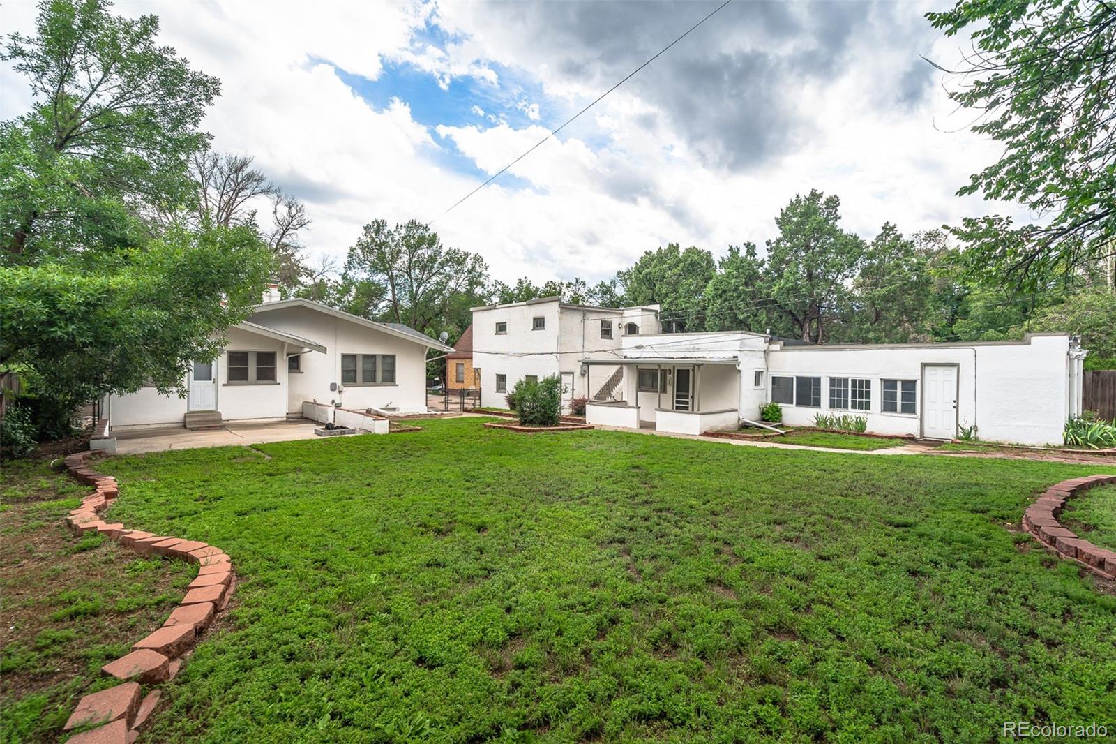 1118 East Platte Avenue, Unit B Colorado Springs, CO 80903 - Photo 15 of 15 a front view of a house with garden