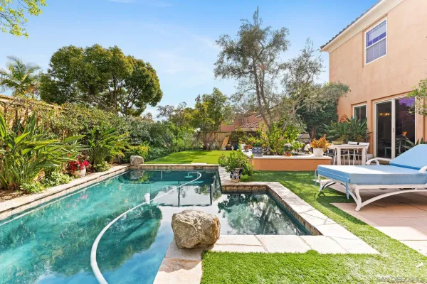 a view of a swimming pool with a patio
