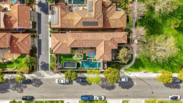 an aerial view of houses with yard