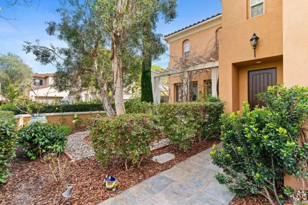 a view of a brick house with a yard
