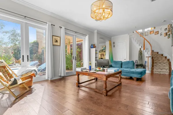 a living room with furniture and a table